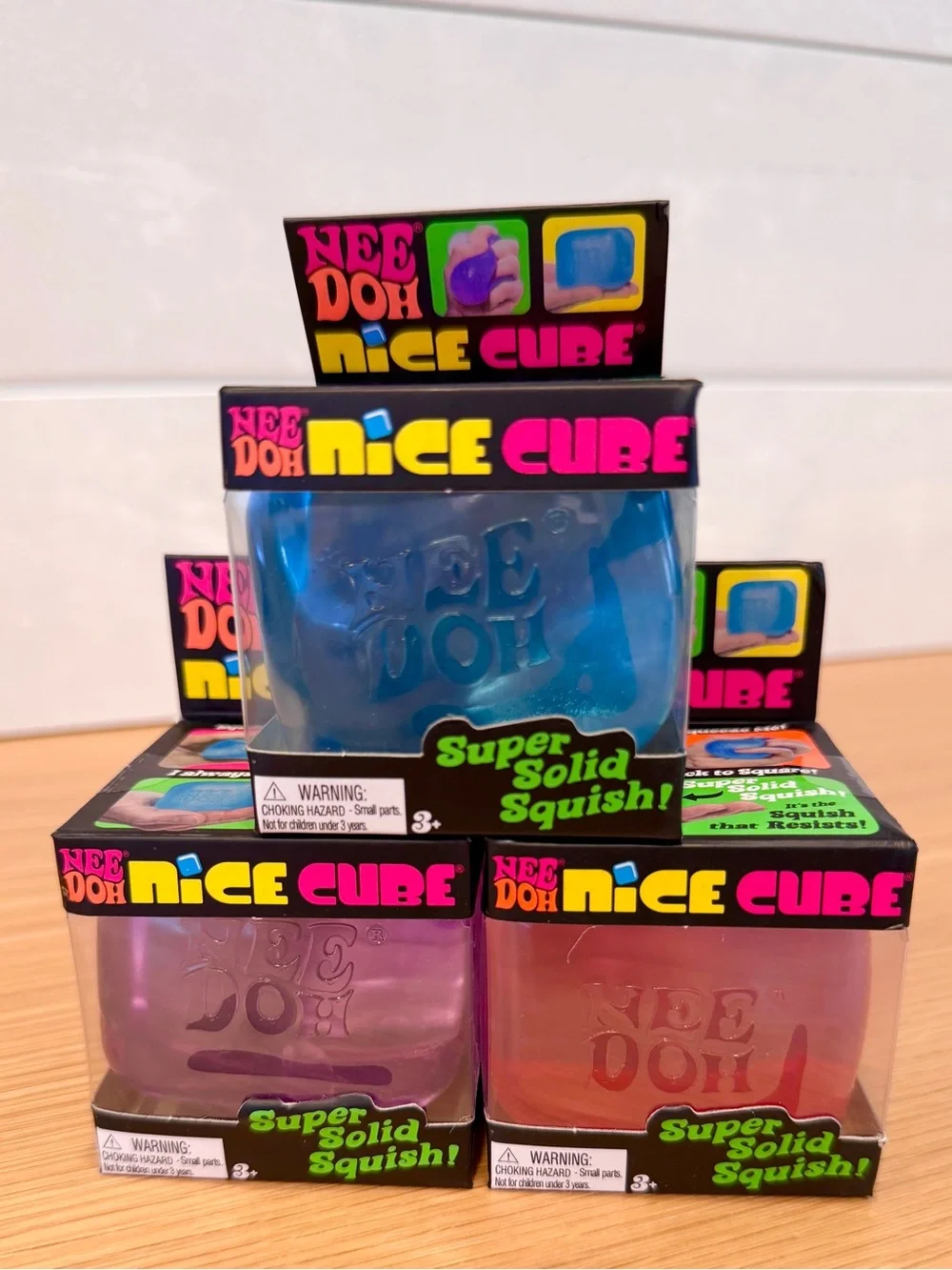 Needoh Nice Cube Squishy Blue, Pink, and Purple